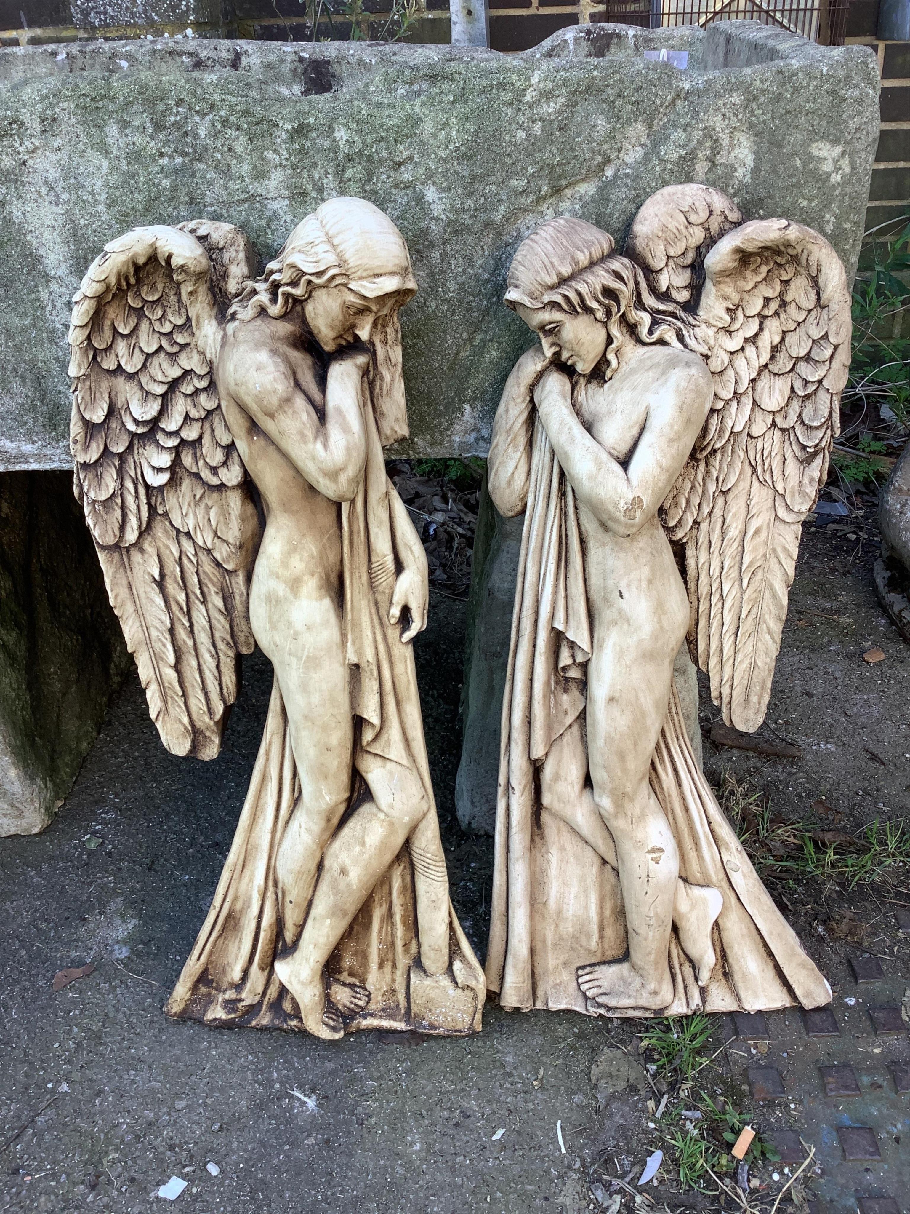 A pair of cast angel wall appliqués, height 78cm. Condition - fair to good